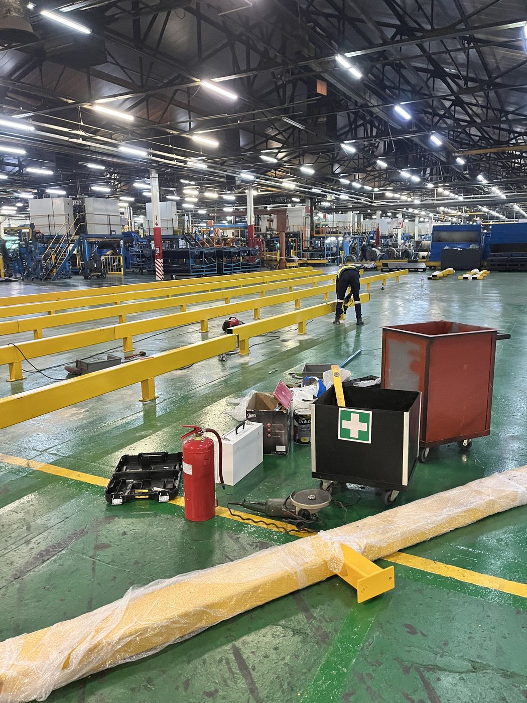 Gebisa Projects team installing structural steel safety guard rails at a commercial facility