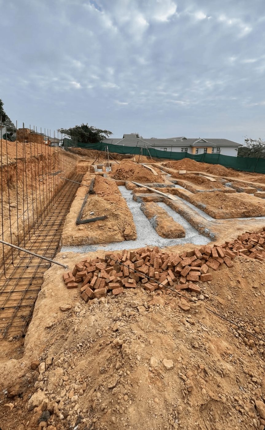 Foundation trenches and rebar for a new Gebisa Projects residential build