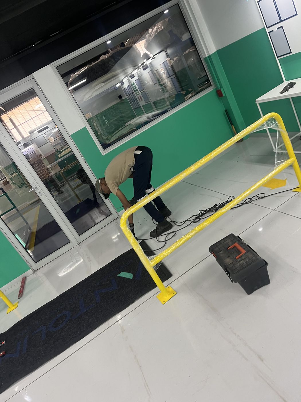 Gebisa Projects team installing a safety guard rail retrofit at a facility