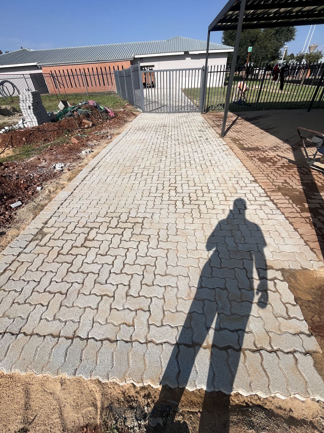 Freshly completed paved driveway maintained by Gebisa Projects