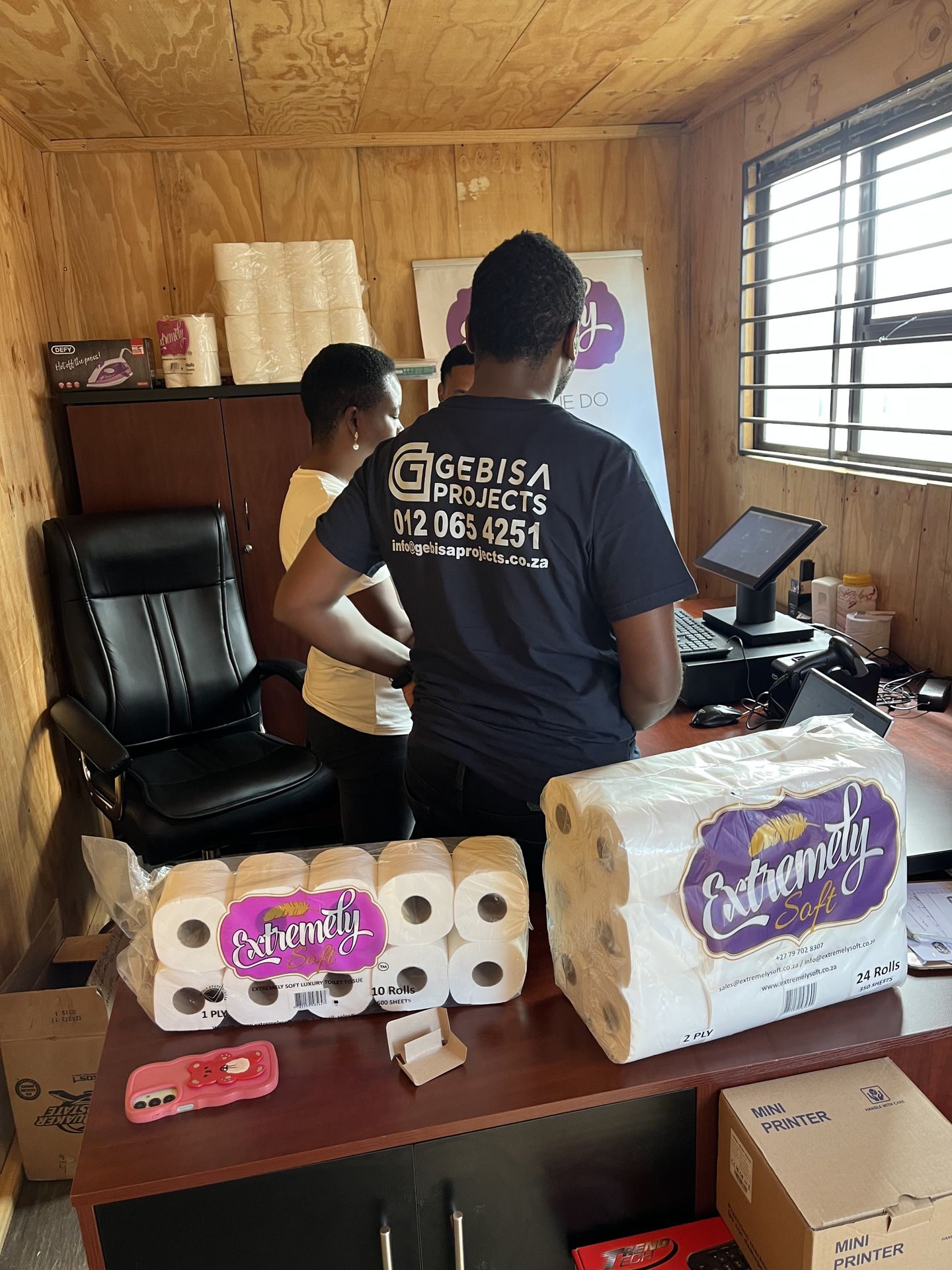 Gebisa Projects team with supplied stock at a client site office