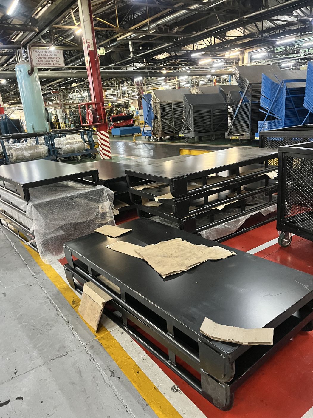 Steel storage platforms and pallets supplied by Gebisa Projects in a warehouse